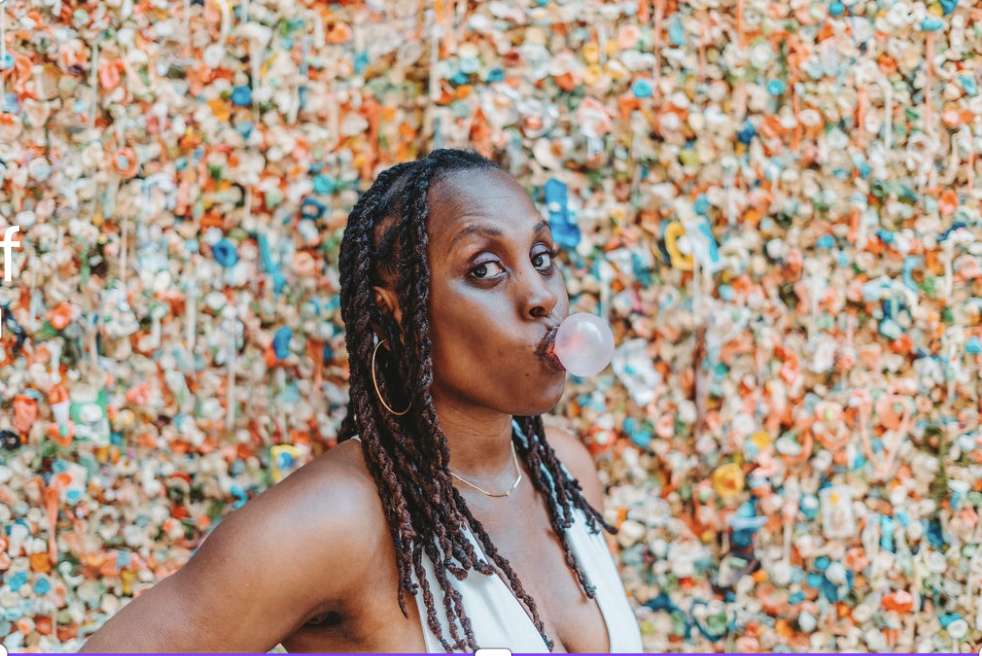 Dr. Naieema blowing a bubble at Pike Place Market
